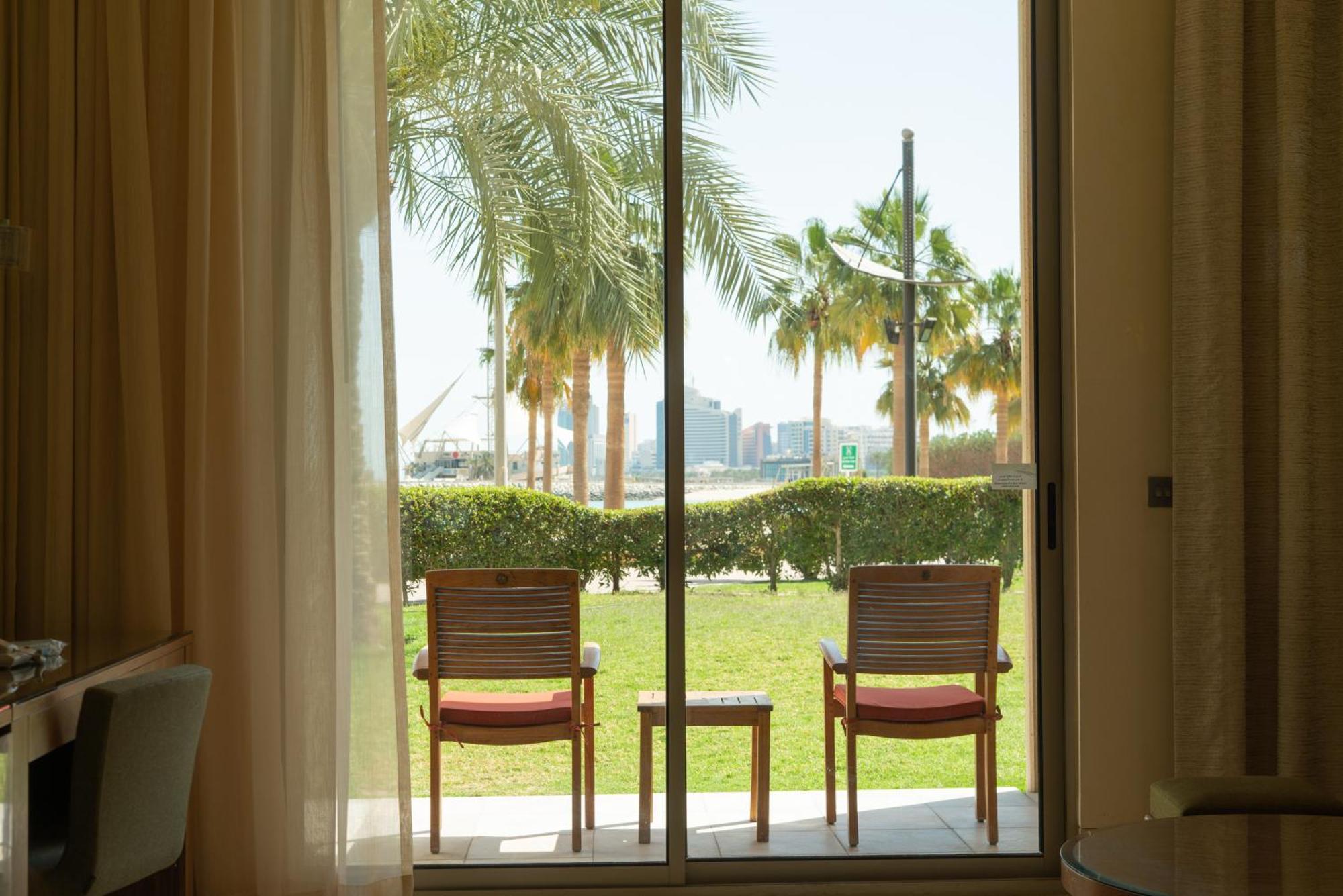 Marina Hotel Kuwait City Exterior photo A view of the Palm Jumeirah from a room at Jumeirah Beach Hotel