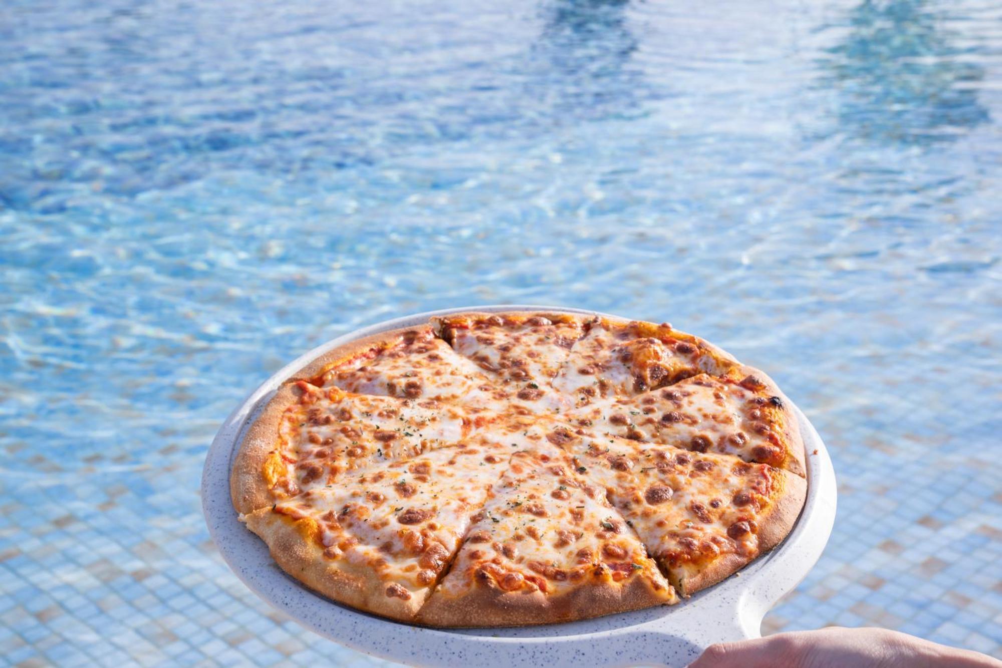 Marina Hotel Kuwait City Exterior photo Pizza floating in a swimming pool